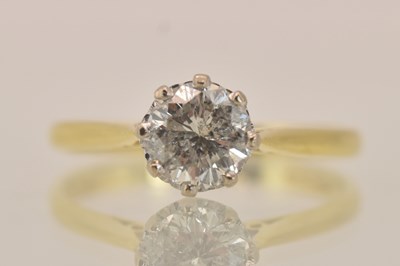 Lot 1334 - An 18ct yellow gold diamond solitaire ring,...