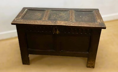 Lot 818 - A 18th century oak coffer, with plain panels...