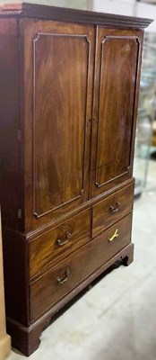Lot 809 - A 19th century mahogany linen press, with two...