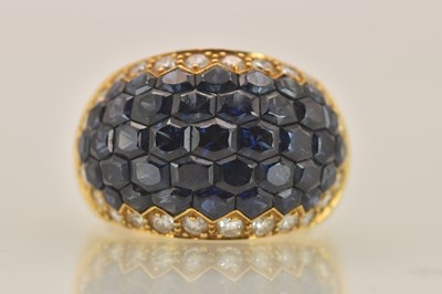 Lot 1232 - An 18ct yellow gold diamond and sapphire bombé...