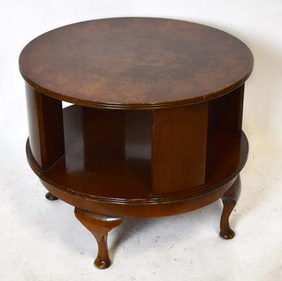 Lot 1755 - A walnut circular revolving coffee table