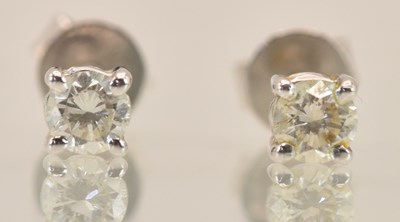 Lot 1452 - A pair of 18ct white gold diamond set ear...