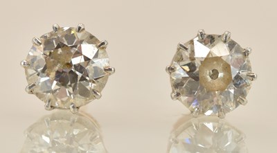 Lot 1482 - A pair of yellow metal diamond set ear studs,...