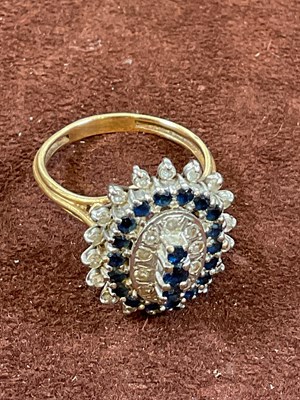 Lot 526 - A large yellow metal sapphire and diamond oval...