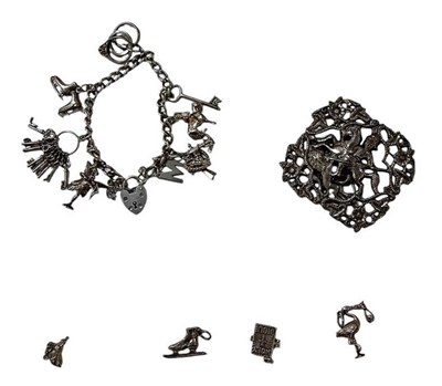 Lot 1543 - A 925 silver charm bracelet, with charms...
