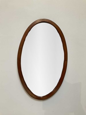 Lot 1027 - An early 20th century oval walnut framed wall...