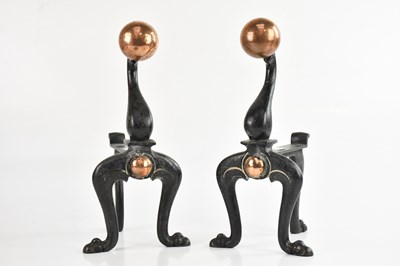 Lot 1301 - A pair of cast iron and copper andirons,...