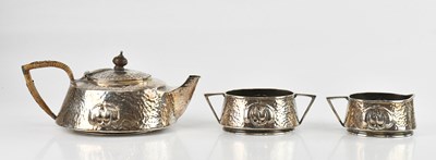 Lot 138 - ENGLISH PEWTER; an Arts and Crafts three-piece...
