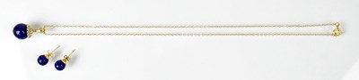 Lot 843 - A 14ct yellow gold pendant set with tiny...