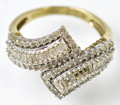Lot 750 - A 9ct yellow gold crossover ring set with...