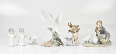Lot 1408 - LLADRO; a model of a dove, height 24cm, a...
