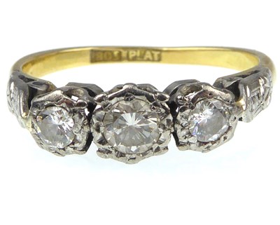 Lot 939 - A Victorian 18ct gold and platinum three-stone...