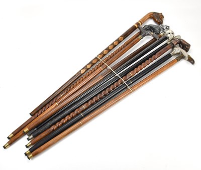 Lot 399 - A collection of modern walking sticks with...