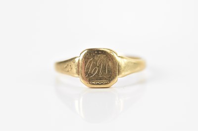 Lot 670 - A yellow metal signet ring with engraved...