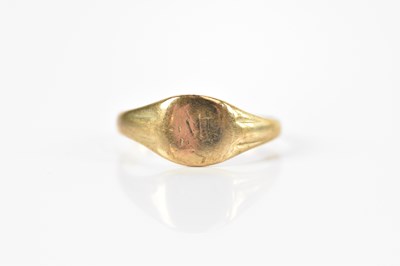 Lot 679 - A yellow metal signet ring, stamped '9C', size...