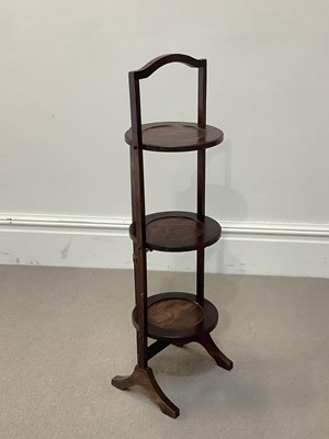 Lot 1073 - A reproduction oak cakestand, height 90cm.