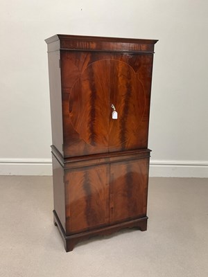Lot 1062 - A reproduction mahogany cocktail cabinet,...