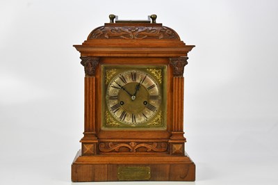 Lot 2298 - A carved mahogany cased mantel clock with...