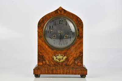 Lot 1182 - A simulated walnut mantel clock, with silvered...