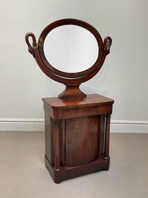 Lot 1076 - An empire style mahogany dressing table with...
