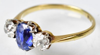 Lot 718 - An 18ct yellow gold ring set with a central...