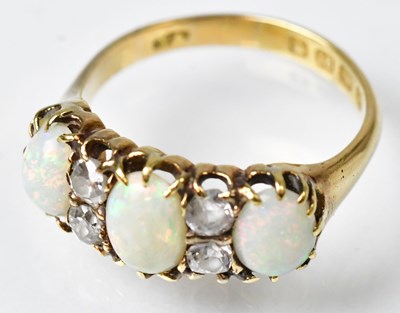 Lot 717 - An 18ct yellow gold ring set with three oval...