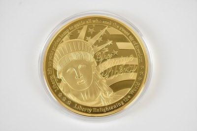 Lot 725 - A 2013 'Liberty Shining the Light' gold plated...
