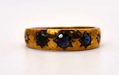 Lot 603 - A 9ct gold five stone sapphire and diamond...
