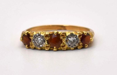Lot 599 - A 18ct gold five stone ruby and diamond ring,...