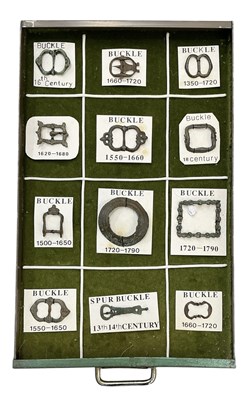 Lot 383 - A collection of twelve ancient metal belt...