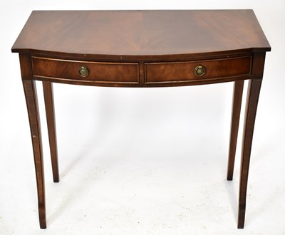 Lot 1754 - A reproduction mahogany two drawer hall/side table