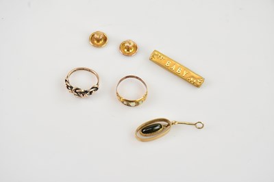 Lot 20 - A yellow metal 'Baby' brooch, stamped '9C', a...