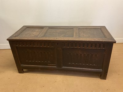 Lot 791 - A late 18th century oak coffer with carved...