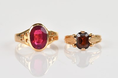 Lot 565 - A yellow metal dress ring set with a faceted...