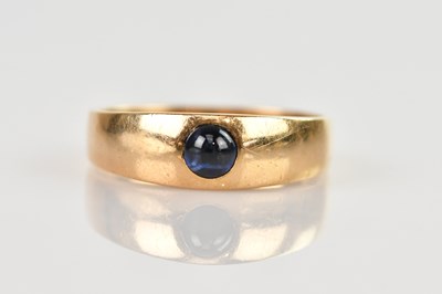 Lot 567 - A yellow metal signet ring set with deep blue...