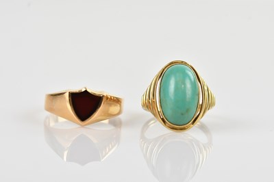 Lot 568 - A yellow metal turquoise set dress ring, with...