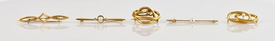 Lot 161 - Four yellow metal brooches, including an...
