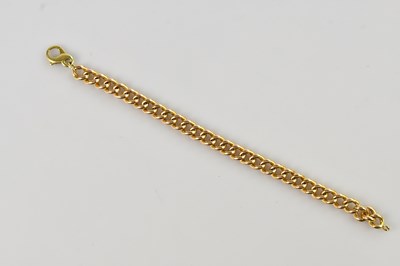 Lot 76 - A yellow metal heavy gauge curb link bracelet,...
