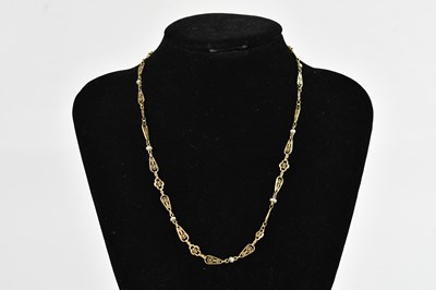 Lot 310 - A yellow metal necklace with pierced links set...