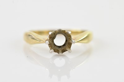 Lot 657 - A yellow metal ring shank, stamped '585', size...