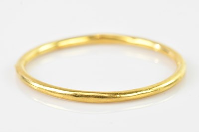 Lot 83 - A yellow metal hinged bangle, tests as 18.21kt...