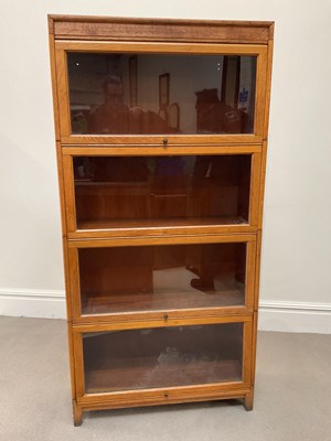 Lot 1003 - A Globe Wernicke style light oak four section...