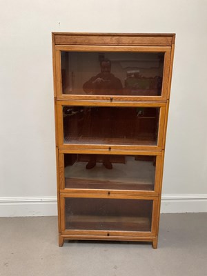 Lot 1004 - A Globe Wernicke style light oak four section...