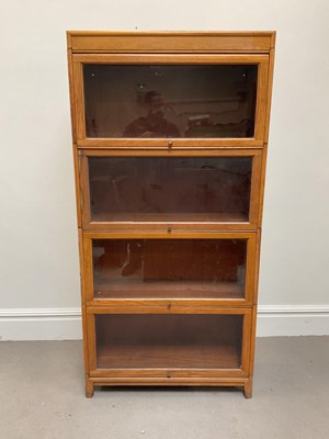 Lot 1005 - A Globe Wernicke style light oak four section...