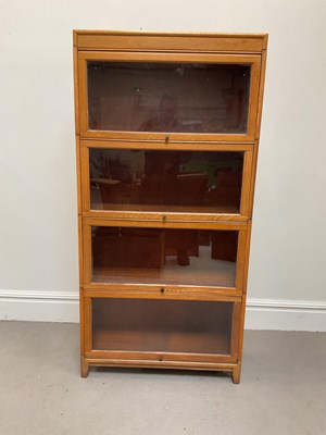 Lot 1006 - A Globe Wernicke style light oak four section...
