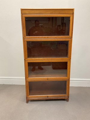 Lot 1007 - A Globe Wernicke style light oak four section...