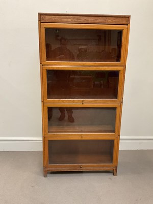 Lot 1008 - A Globe Wernicke style light oak four section...
