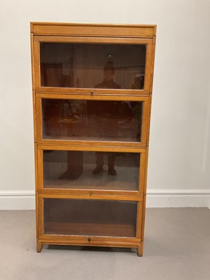 Lot 1009 - A Globe Wernicke style light oak four section...