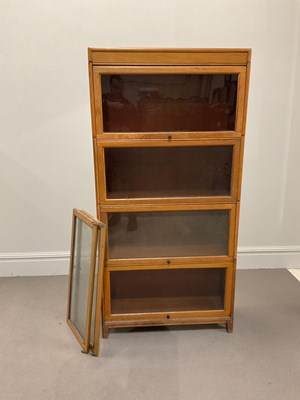 Lot 1010 - A Globe Wernicke style light oak four section...