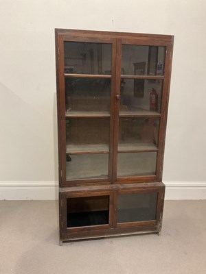 Lot 1146 - A Minty stained pine bookcase, with four...